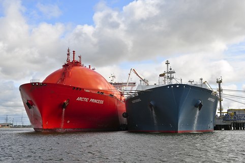 A Liquified Natural Gas vessel alongside another vessel in port